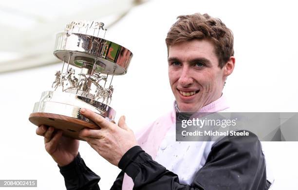 Jack Kennedy poses with the trophy after winning the Betway Paddy Power Stayers Hurdle on board Teahupoo during day three of the Cheltenham Festival...