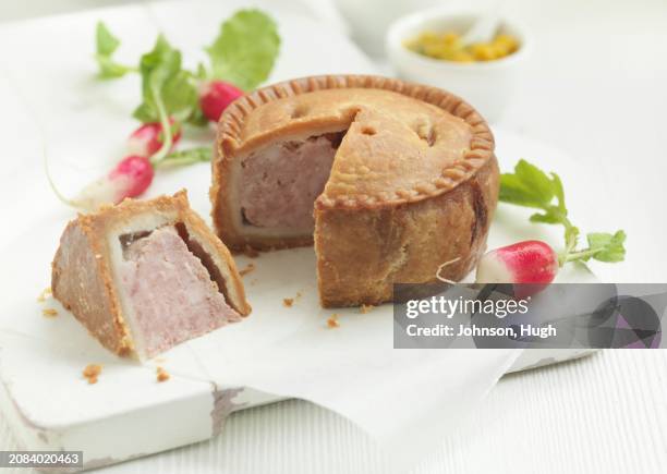 pork pie, a piece removed (uk) - pork pie stock pictures, royalty-free photos & images