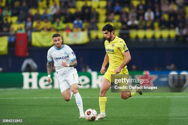 Gonzalo Guedes of Villarreal CF and Jonathan Clauss of Olympique Marseille battle for the ball during the UEFA Europa League 2023/24 round of 16...