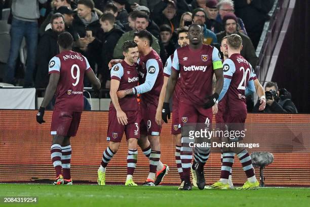 Aaron Cresswell of West Ham United celebrates after scoring his team's third goal with teammates during the UEFA Europa League 2023/24 round of 16...