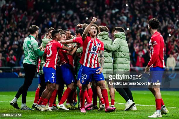 Axel Witsel of Atletico de Madrid celebrates with his teammates after winning Internazionale during the UEFA Champions League 2023/24 round of 16...