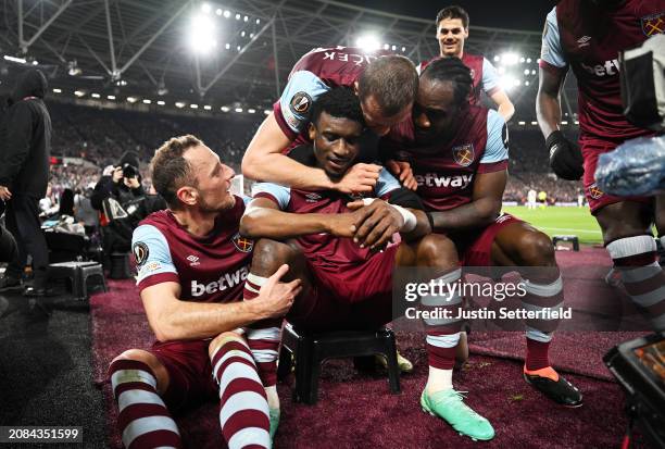 Mohammed Kudus of West Ham United celebrates scoring his team's fourth goal with teammates during the UEFA Europa League 2023/24 round of 16 second...