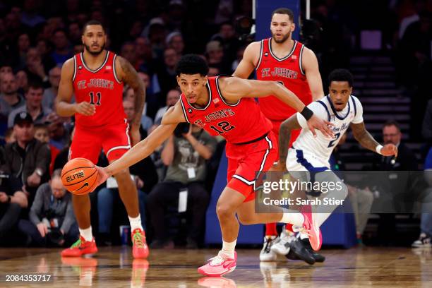 Luis Jr. #12 of the St. John's Red Storm dribbles in the first half against the Seton Hall Pirates during the Quarterfinals of the Big East...