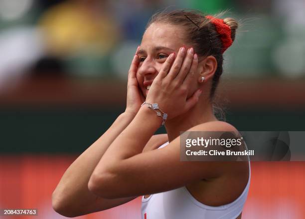 Marta Kostyuk of Ukraine reacts after her straight set victory against Anastasia Potapova in their Quarterfinal match during the BNP Paribas Open at...