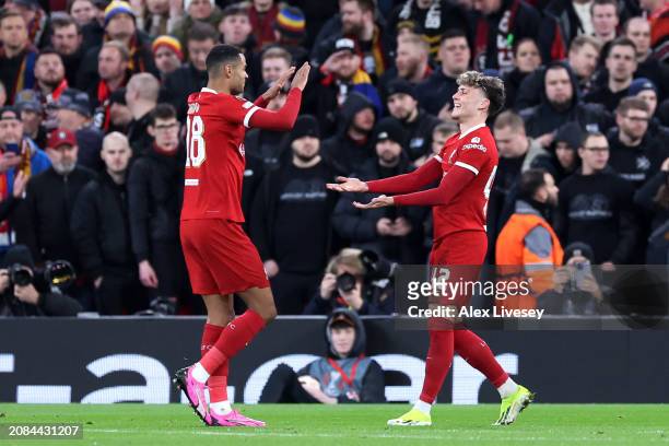 Bobby Clark of Liverpool celebrates scoring his team's second goal with teammate Cody Gakpo during the UEFA Europa League 2023/24 round of 16 second...