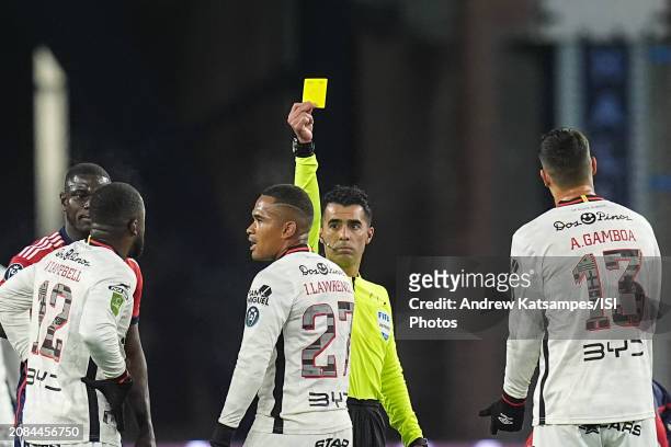 Referee Adonai Escobedo shows the yellow card to Ian Lawrence of LD Alajuelense during a Concacaf Champions Cup: Round of 16 between LD Alajuelense...