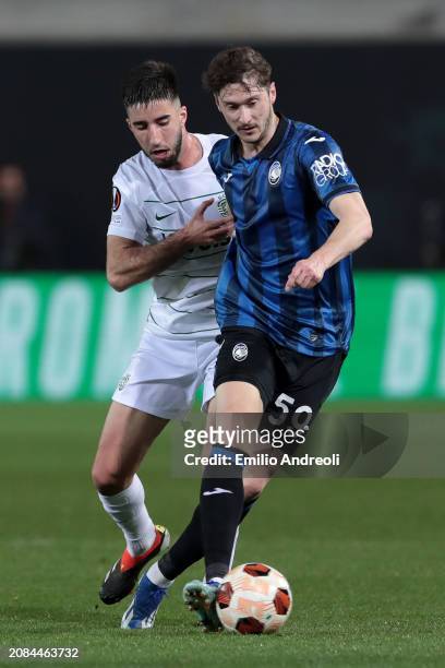 Aleksey Miranchuk of Atalanta BC is challenged by Goncalo Inacio of Sporting CP during the UEFA Europa League 2023/24 round of 16 second leg match...