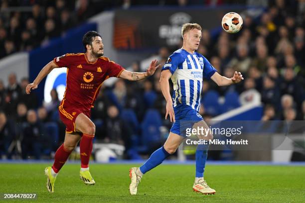 Sardar Azmoun of AS Roma challenges Jan Paul van Hecke of Brighton & Hove Albion during the UEFA Europa League 2023/24 round of 16 second leg match...