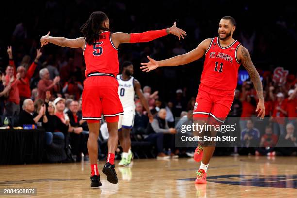 Daniss Jenkins and Joel Soriano of the St. John's Red Storm react after scoring in the second half against the Seton Hall Pirates during the...