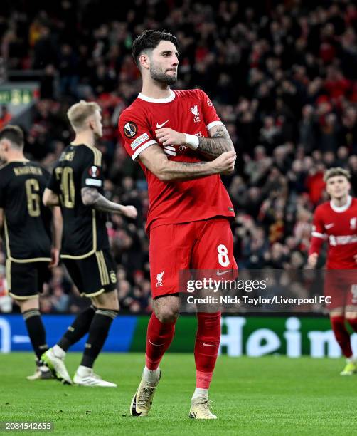 Dominik Szoboszlai of Liverpool celebrates scoring Liverpool's fifth goal during the UEFA Europa League 2023/24 round of 16 second leg match between...