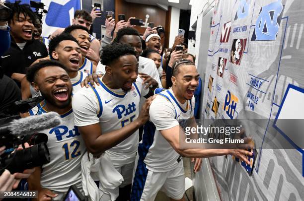 Ishmael Leggett of the Pittsburgh Panthers advances the sticker on the bracket with his teammates after a victory against the Wake Forest Demon...