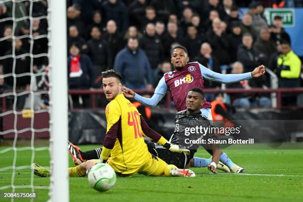 Leon Bailey of Aston Villa scores his team's second goal past Jorrel Hato and Diant Ramaj of Ajax during the UEFA Europa Conference League 2023/24...