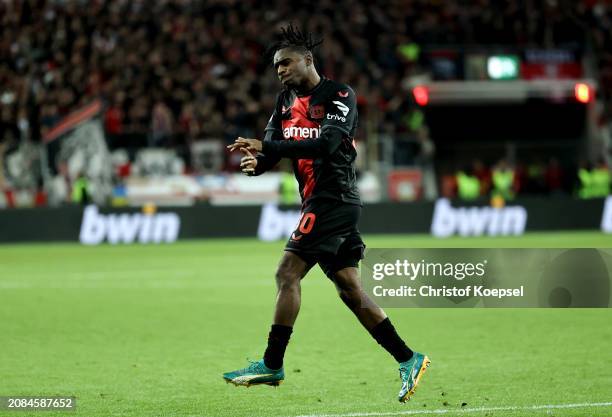 Jeremie Frimpong of Bayer Leverkusen celebrates scoring his team's first goal during the UEFA Europa League 2023/24 round of 16 second leg match...