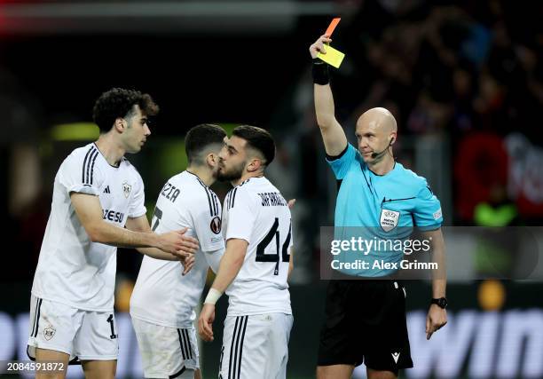 Elvin Jafarguliyev of Qarabag FK looks dejected after being shown a red card by Referee Anthony Taylor after the initial yellow card was cancelled...