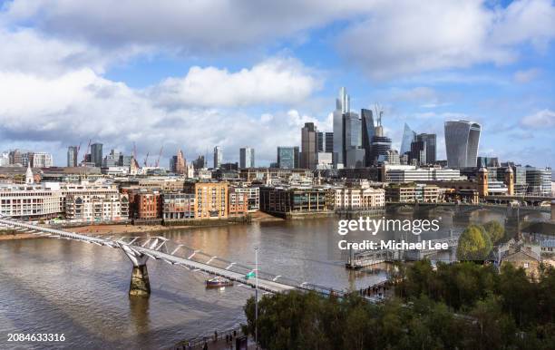sunny aerial view of millennium bridge and city of london - city di londra foto e immagini stock