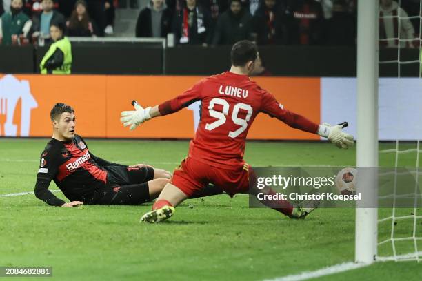 Patrik Schick of Leverkusen scors the second goal against Andrey Lunev of Qarabag FK during the UEFA Europa League 2023/24 round of 16 second leg...