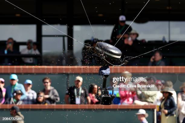 Swarm of bees cover the spider cam after suddenly invading the court whilst Carlos Alcaraz of Spain and Alexander Zverev of Germany were playing in...