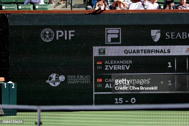 Swarm of bees cover the scoreboard after suddenly invading the court whilst Carlos Alcaraz of Spain and Alexander Zverev of Germany were playing in...