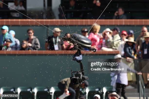 Swarm of bees cover the spider cam after suddenly invading the court whilst Carlos Alcaraz of Spain and Alexander Zverev of Germany were playing in...