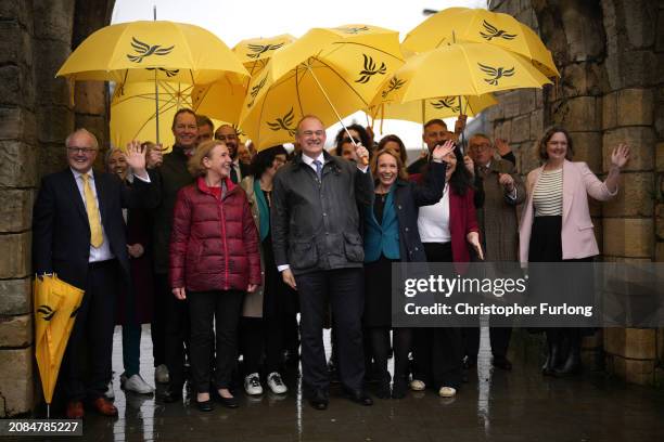 Liberal Democrat leader Ed Davey and Helen Morgan MP react as they walk the City of York walls on arrival for the Liberal Democrat Spring Conference...