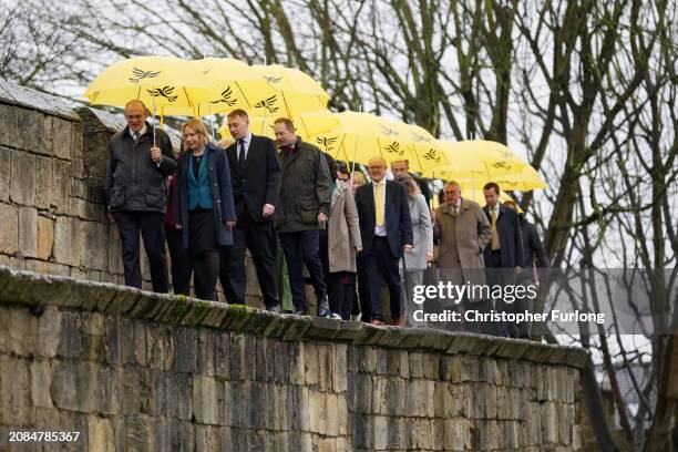 Liberal Democrat leader Ed Davey and Helen Morgan MP walk the City of York walls as they arrive for the Liberal Democrat Spring Conference at York...