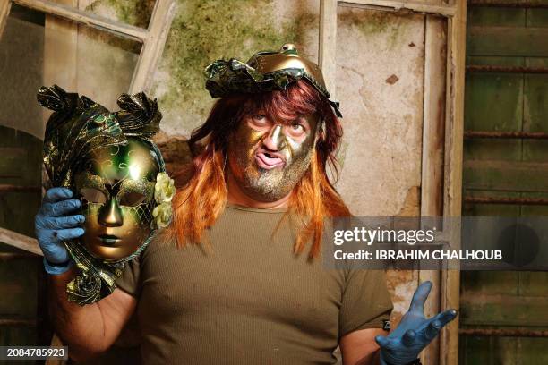 Carnival participant poses for a picture in costume during the Zambo carnival held in the northern Lebanese city of Tripoli on March 17 to mark the...