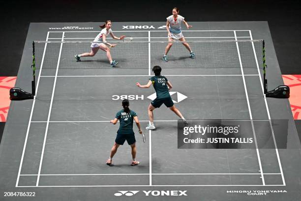 Japan's Nami Matsuyama and Japan's Chiharu Shida return the shuttlecock to South Korea's Baek Ha Na and South Korea's Lee So Hee during the Women's...