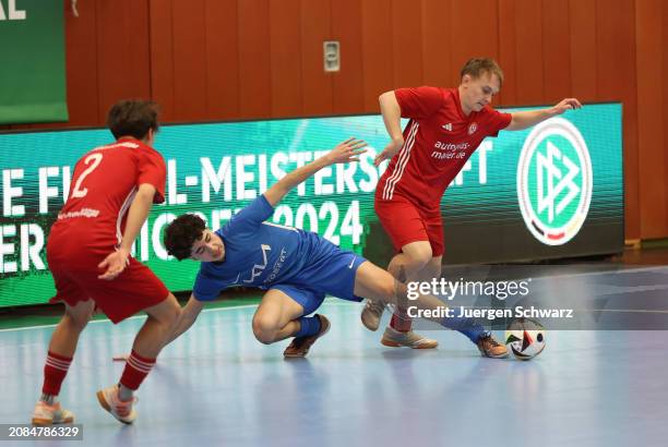 Players of Rosenheim and Waltrop battle for the ball during the German Futsal Championships for B Juniors 2024 at Sport School Wedau on March 17,...