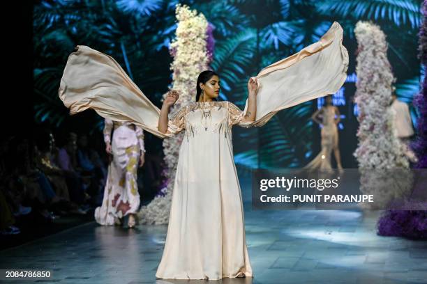 Model presents a creation by designer Preeti Jain during the fifth and final day of Lakmé Fashion Week x FDCI in Mumbai on March 17, 2024. / -- IMAGE...