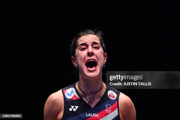 Spain's Carolina Marin celebrates as she wins against Japan's Akane Yamaguchi during the Women's Singles Final at the All England Open Badminton...