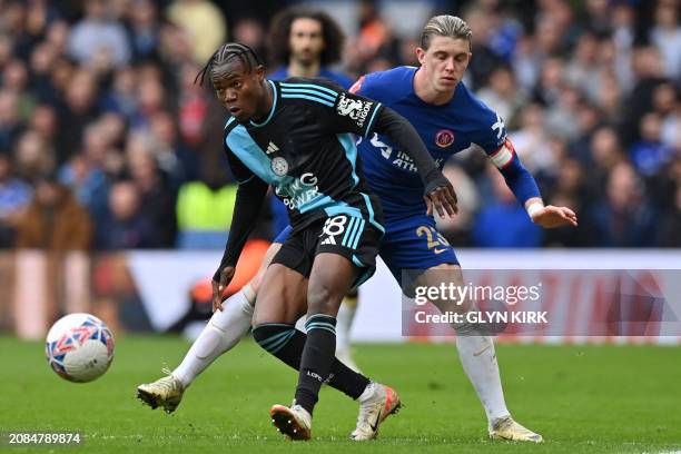Leicester City's Ghanaian striker Abdul Fatawu vies with Chelsea's English midfielder Conor Gallagher during the English FA Cup Quarter Final...