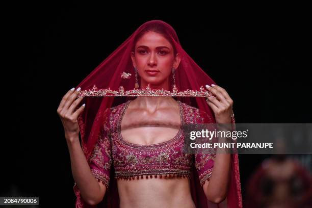 Model presents a creation by designer house Kalki during the fifth and final day of Lakmé Fashion Week x FDCI in Mumbai on March 17, 2024. / -- IMAGE...