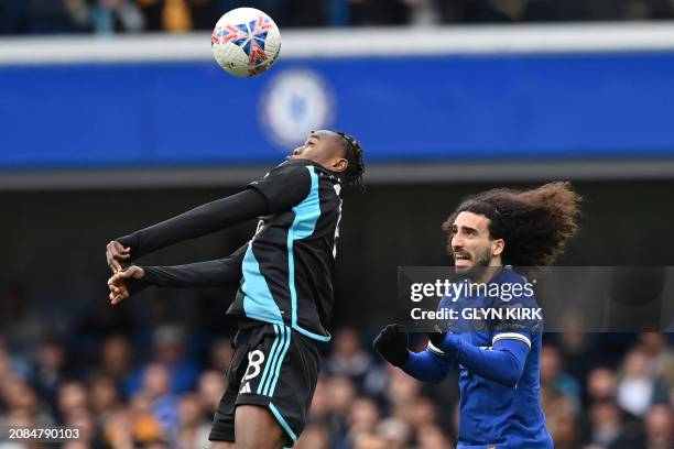 Leicester City's Ghanaian striker Abdul Fatawu wins a header during the English FA Cup Quarter Final football match between Chelsea and Leicester...