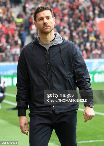 Bayer Leverkusen's Spanish head coach Xabi Alonso looks on prior to the German first division Bundesliga football match between SC Freiburg and Bayer...