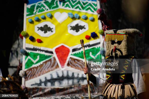 Participants dressed in colorful hand-made costumes and masks attend Mask Festival 'Kukerlandia' in Yambol town of Bulgaria on March 17, 2024....