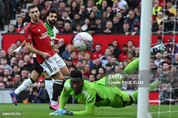 Liverpool's Egyptian striker Mohamed Salah watches his shot go wide during the English FA Cup Quarter Final football match between Manchester United...