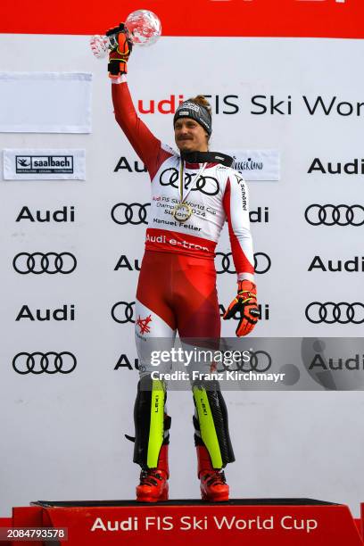 Overall Slalom winner Manuel Feller of Austria celebrates at the Men's Slalom at Audi FIS Alpine Ski World Cup Finals on March 17, 2024 in...