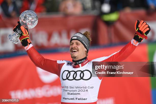 Overall Slalom winner Manuel Feller of Austria celebrates at the Men's Slalom at Audi FIS Alpine Ski World Cup Finals on March 17, 2024 in...