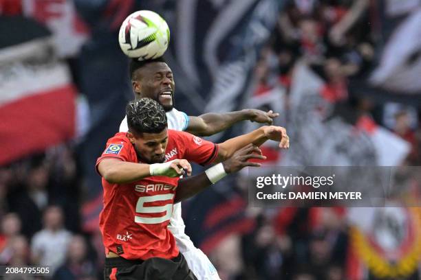 Rennes' French midfielder Ludovic Blas fights for the ball with Marseille's Congolese defender Chancel Mbemba during the French L1 football match...