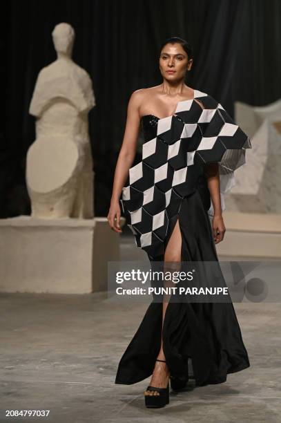 Model presents a creation by designer Rahul Mishra during the grand final of Lakmé Fashion Week x FDCI in Mumbai, on March 17, 2024.