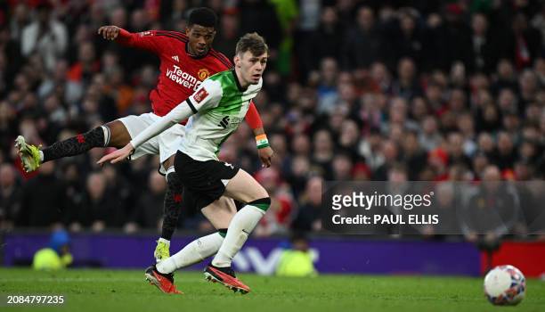 Manchester United's Ivorian midfielder Amad Diallo scores the winning goal in extra-time during the English FA Cup Quarter Final football match...