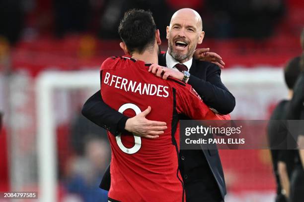 Manchester United's Portuguese midfielder Bruno Fernandes and Manchester United's Dutch manager Erik ten Hag celebrate on the pitch after extra-time...