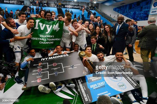 The Yale Bulldogs celebrate the victory with their NCAA Men's Basketball Tournament Ticket after the Ivy League Men's Basketball Championship game...