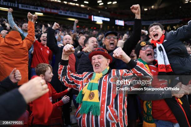 Manchester United fans celebrate after the Emirates FA Cup Quarter Final match between Manchester United and Liverpool at Old Trafford on March 17,...