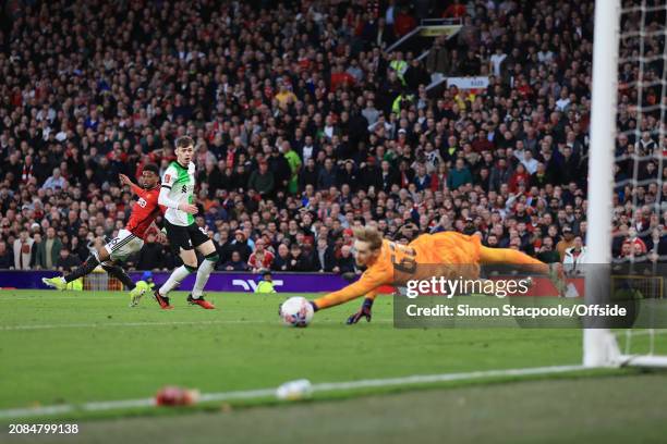 Amad Diallo of Manchester United scores their 4th goal during the Emirates FA Cup Quarter Final match between Manchester United and Liverpool at Old...