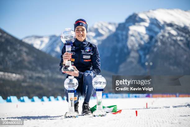 Lisa Vittozzi of Italy with the trophy for the total, individual and pursuit world cup score after the Women 12.5 km Mass Start at the BMW IBU World...