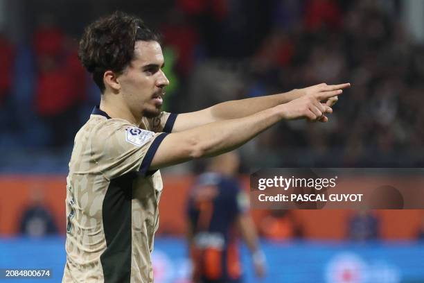 Paris Saint-Germain's Portuguese midfielder Vitinha celebrates scoring his team's first goal during the French L1 football match between Montpellier...