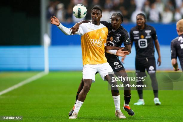 Banzuzi Ezechiel forward of OH Leuven battles for the ball with Mukau Ngal'Ayel midfielder of KV Mechelen during the Jupiler Pro League match between...