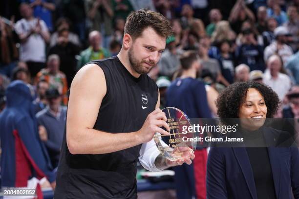 Luka Doncic of the Dallas Mavericks receives the Western Conference Player of the Month award before the game against the Dallas Mavericks on March...