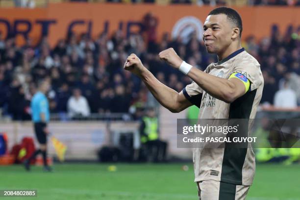 Paris Saint-Germain's French forward Kylian Mbappe celebrates after scoring his team's fifth goal, scoring a hat-trick, during the French L1 football...